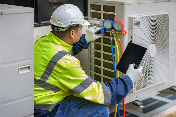 Professional Heat Pump Repair technician working in Melville, NY